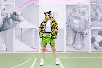Woman Wearing Coat With Green Mini Skirt