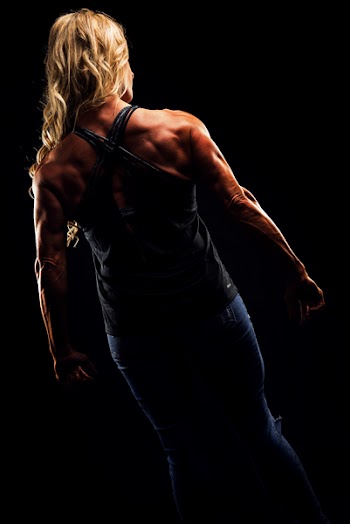 Woman Wearing Criss Cross Back Strap Top Flexing