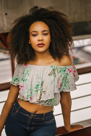 Woman Wearing Crop Top And Denim Bottoms