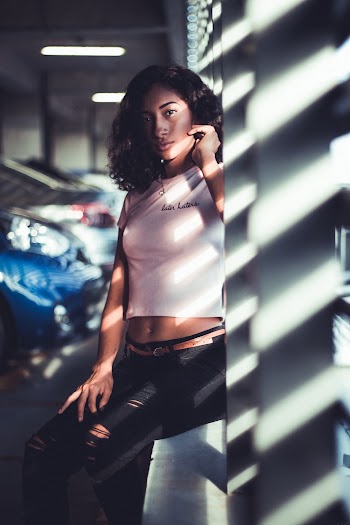 Woman Wearing Crop Top and Ripped Jeans