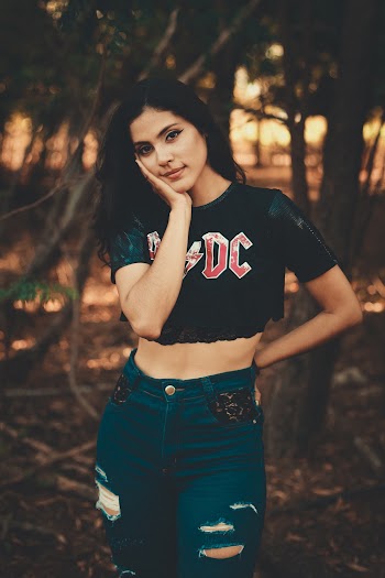 Woman Wearing Crop Top and Ripped Jeans
