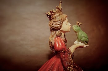 Woman Wearing Crown Holding Frog Figurine