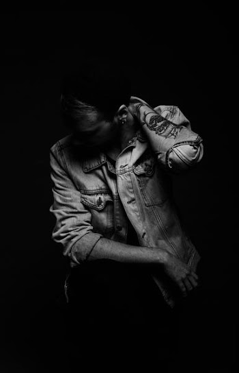 woman wearing denim jacket