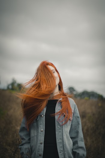 Woman Wearing Denim Jacket and Black Shirt