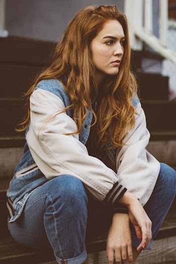 Woman Wearing Denim Jacket and Denim Jeans