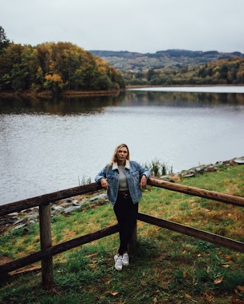 Woman Wearing Denim Jacket Near Lake