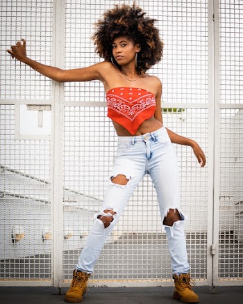 Woman Wearing Distress Blue Denim Jeans