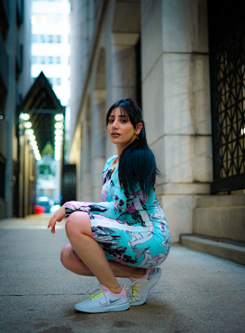 Woman Wearing Dress and Sneakers