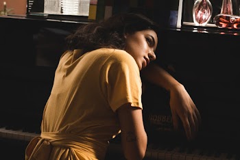 Woman Wearing Dress Beside Piano