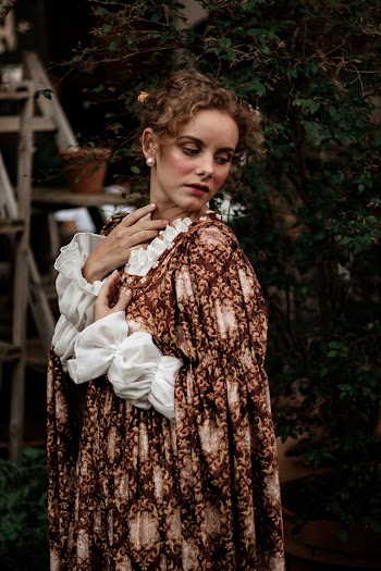Woman Wearing Dress While Looking Downwards