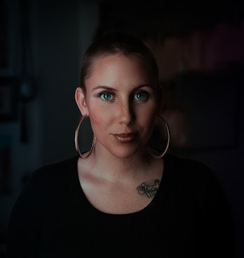 Woman Wearing Earrings and Black Shirt