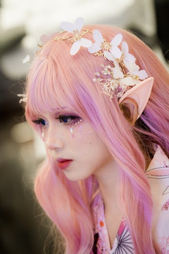Woman Wearing Elf Ear and Floral Headdress