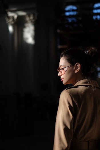 Woman Wearing Eyeglasses and Brown Coat