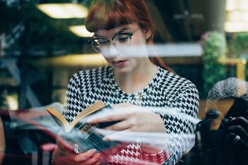Woman Wearing Eyeglasses Reading Book