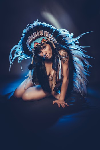 Woman Wearing Feather Head Dress 