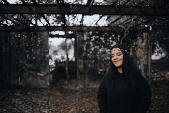 Woman Wearing Floral Headdress and Black Jacket