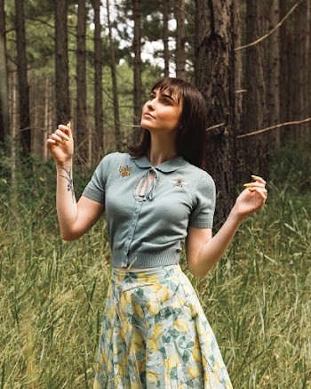 Woman Wearing Floral Skirt Near Grass And Trees