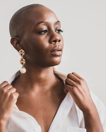 Woman Wearing Gold-colored Chandelier Earring