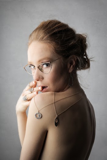Woman Wearing Gold-colored Framed Eyeglasses