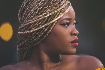 Woman Wearing Gold-colored Necklace