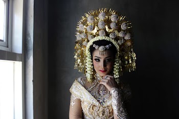 Woman Wearing Gold Headdress And Top