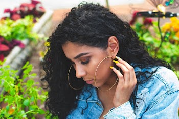 Woman Wearing Gold Hoop Earrings