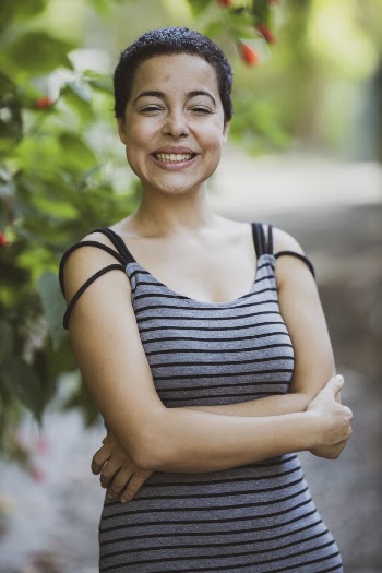Woman Wearing Gray and Black Striped Spaghetti Strap Dress Standing and Laughing