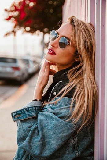 woman wearing gray aviator sunglasses with silver-colored frames