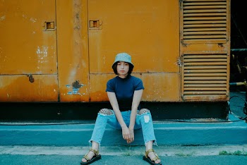 Woman Wearing Gray Bucket Hat