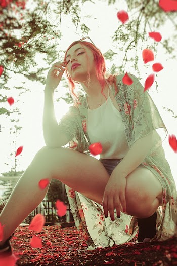 Woman Wearing Gray Cardigan and White Halter Top