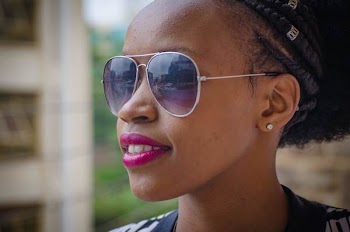Woman Wearing Gray Framed Sunglasses and Pink Lipstick