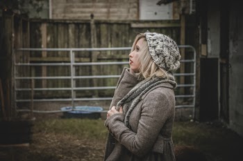 Woman Wearing Gray Hoodie and Knit Cap