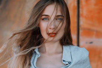 woman wearing gray striped top