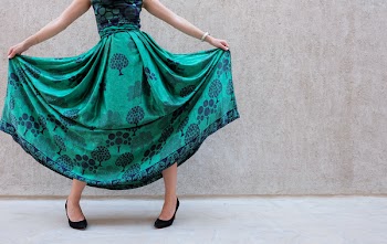 Woman Wearing Green And Black Sleeveless Dress
