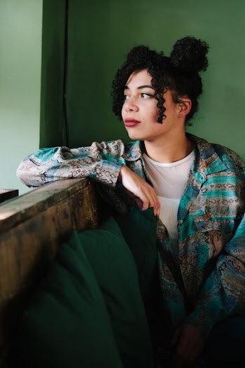 woman wearing green and brown dress shirt