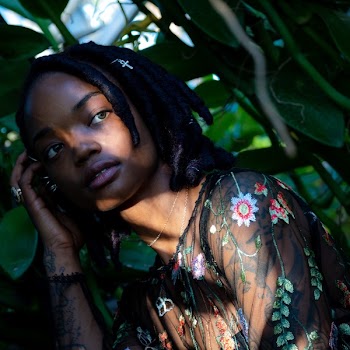 Woman Wearing Green and Pink Floral Top