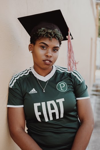 Woman Wearing Green And White Adidas Jersey Shirt