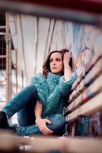 Woman Wearing Green and White Turtle-neck Shirt Screengrab