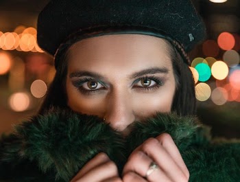 woman wearing green fur coat