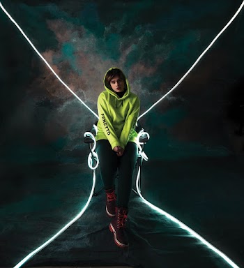 Woman Wearing Green Hoodie and Black Pants