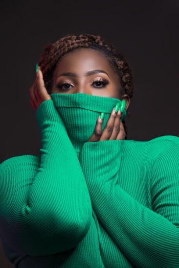 Woman Wearing Green Rib Turtleneck Sweater