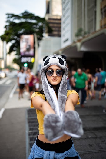 Woman Wearing Grey Racoon Hat