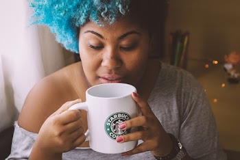 Woman Wearing Grey Top Holding White Ceramic Mug