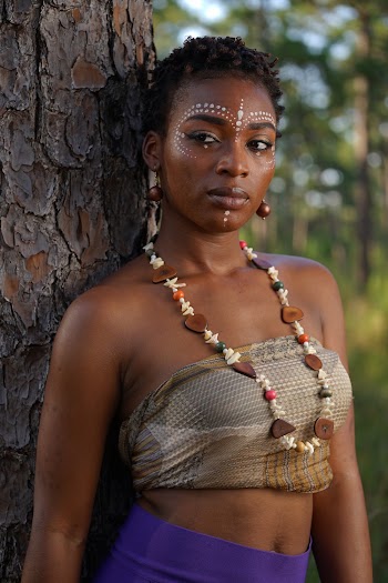 Woman Wearing Grey Tube Top Leaning on Tree