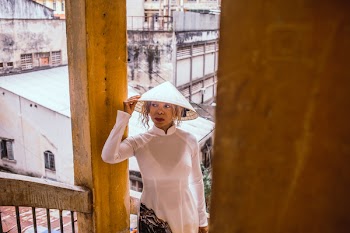 Woman Wearing Hat Standing On Stairs