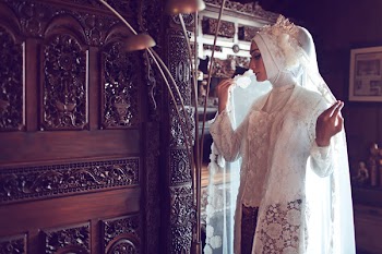 Woman Wearing Hijab Near Floor Lamp