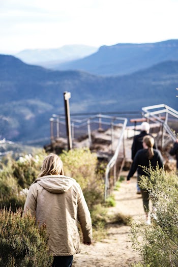 Woman Wearing Hoodie on High Ground