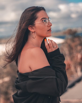 Woman Wearing Jacket and Eyeglasses