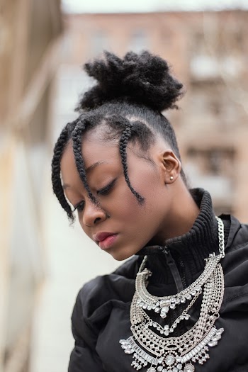 Woman Wearing Jacket and Necklace