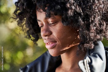 woman wearing jacket outdoors close-up on a fall day